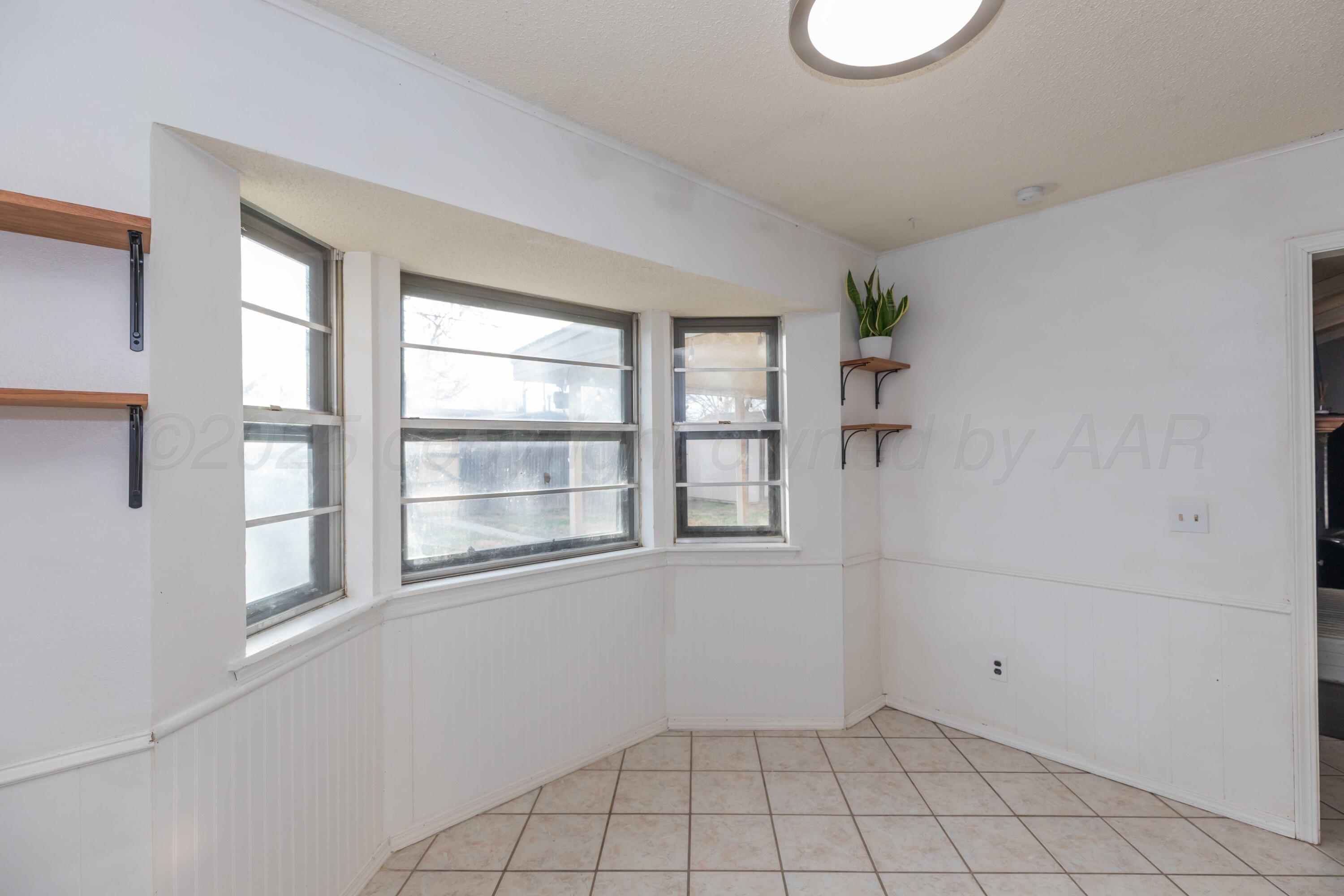 5301 Leigh Avenue Amarillo, TX 79110 - Photo 15 of 35 a view of an empty room with a window