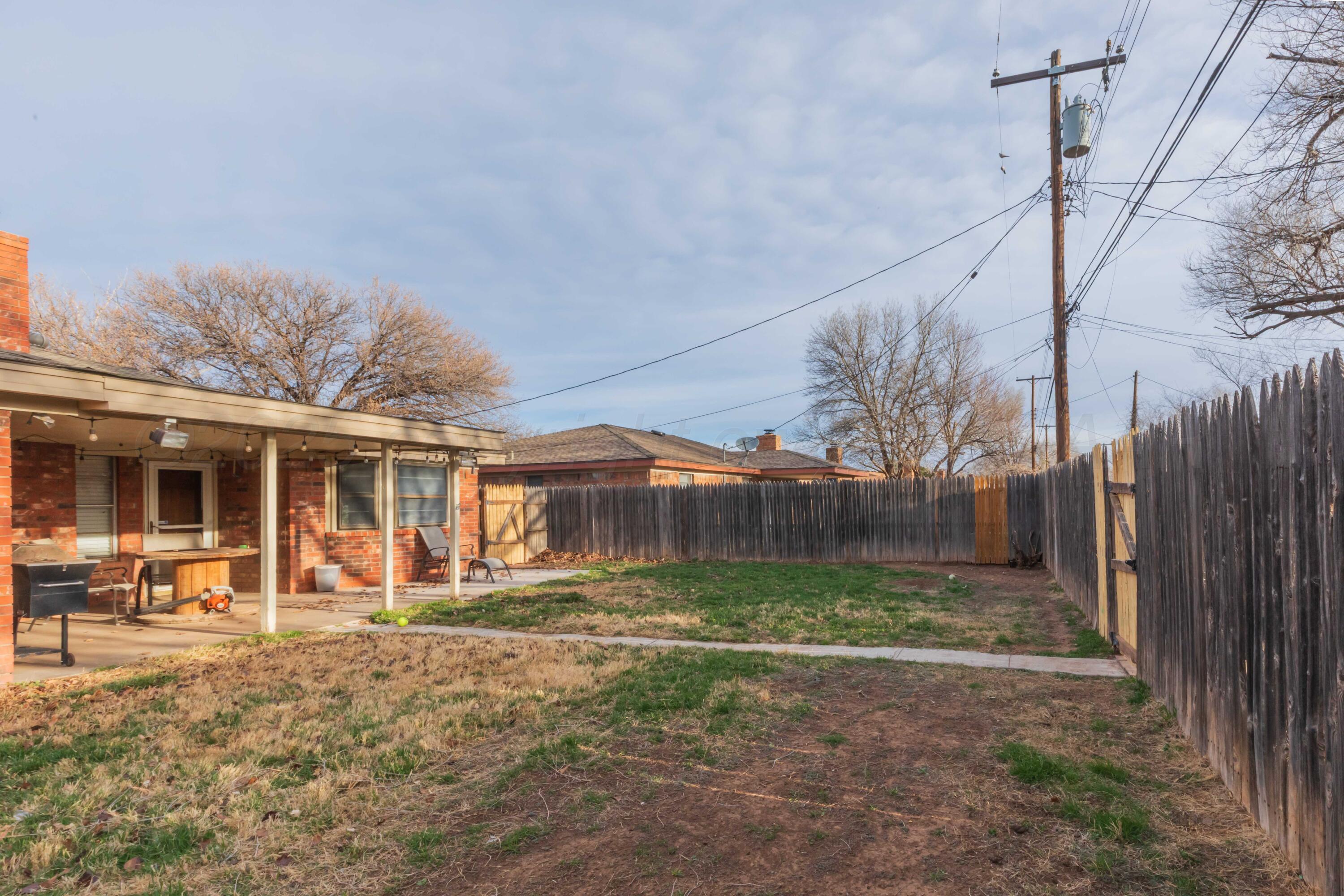 5301 Leigh Avenue Amarillo, TX 79110 - Photo 33 of 35 a front view of a house with a yard and table and chairs