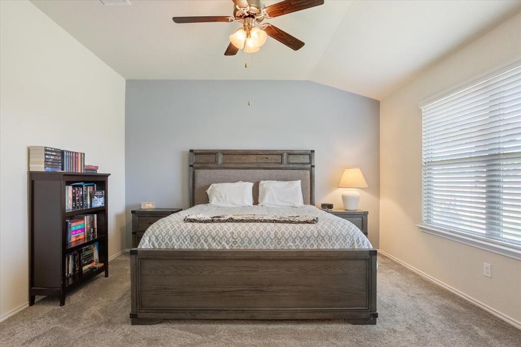 5308 Tama Drive Waco, TX 76708 - Photo 15 of 29 a bedroom with a bed and a book shelf