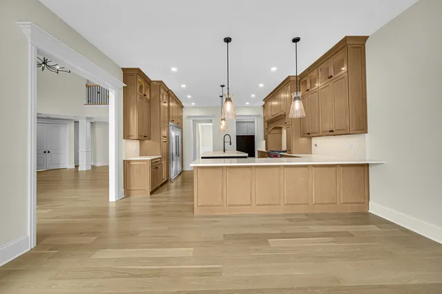 a view of kitchen with furniture and wooden floor