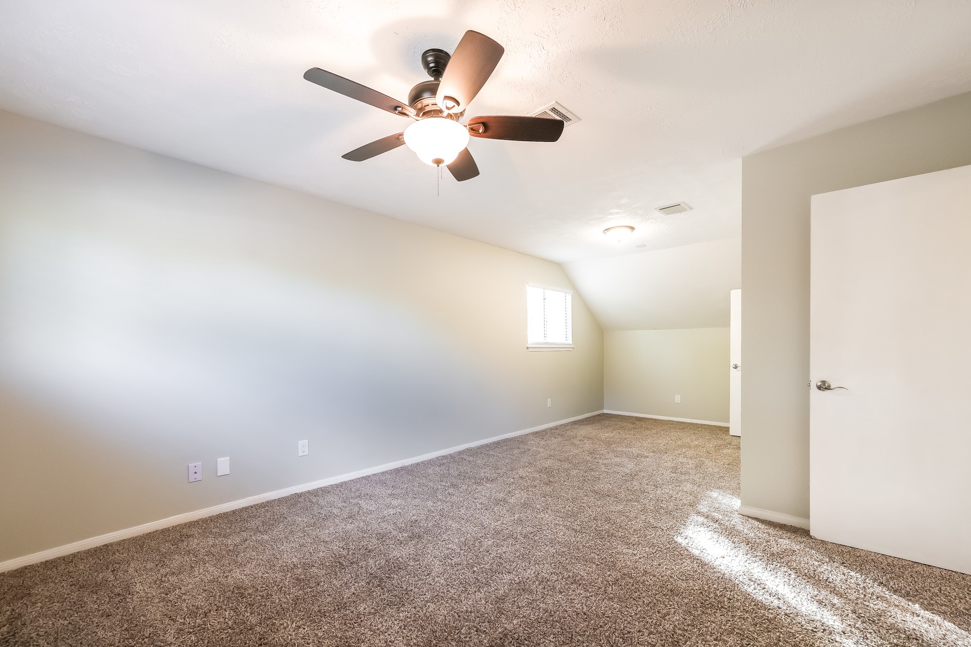22826 Provincial Boulevard Katy, TX 77450 - Photo 13 of 18 an empty room with windows and fan