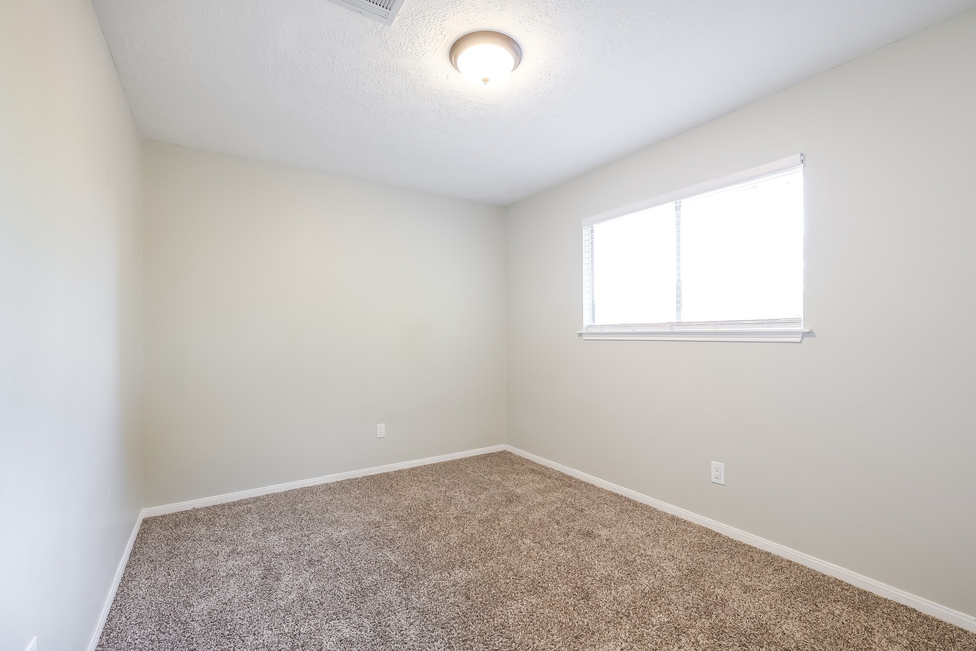22826 Provincial Boulevard Katy, TX 77450 - Photo 14 of 18 an empty room with a window