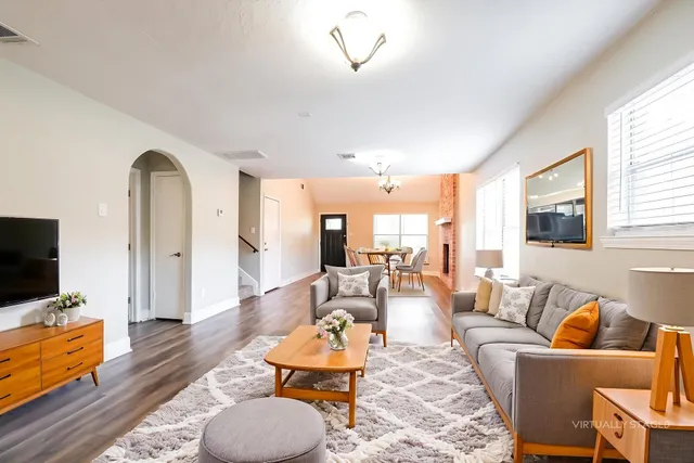 a living room with furniture and a flat screen tv