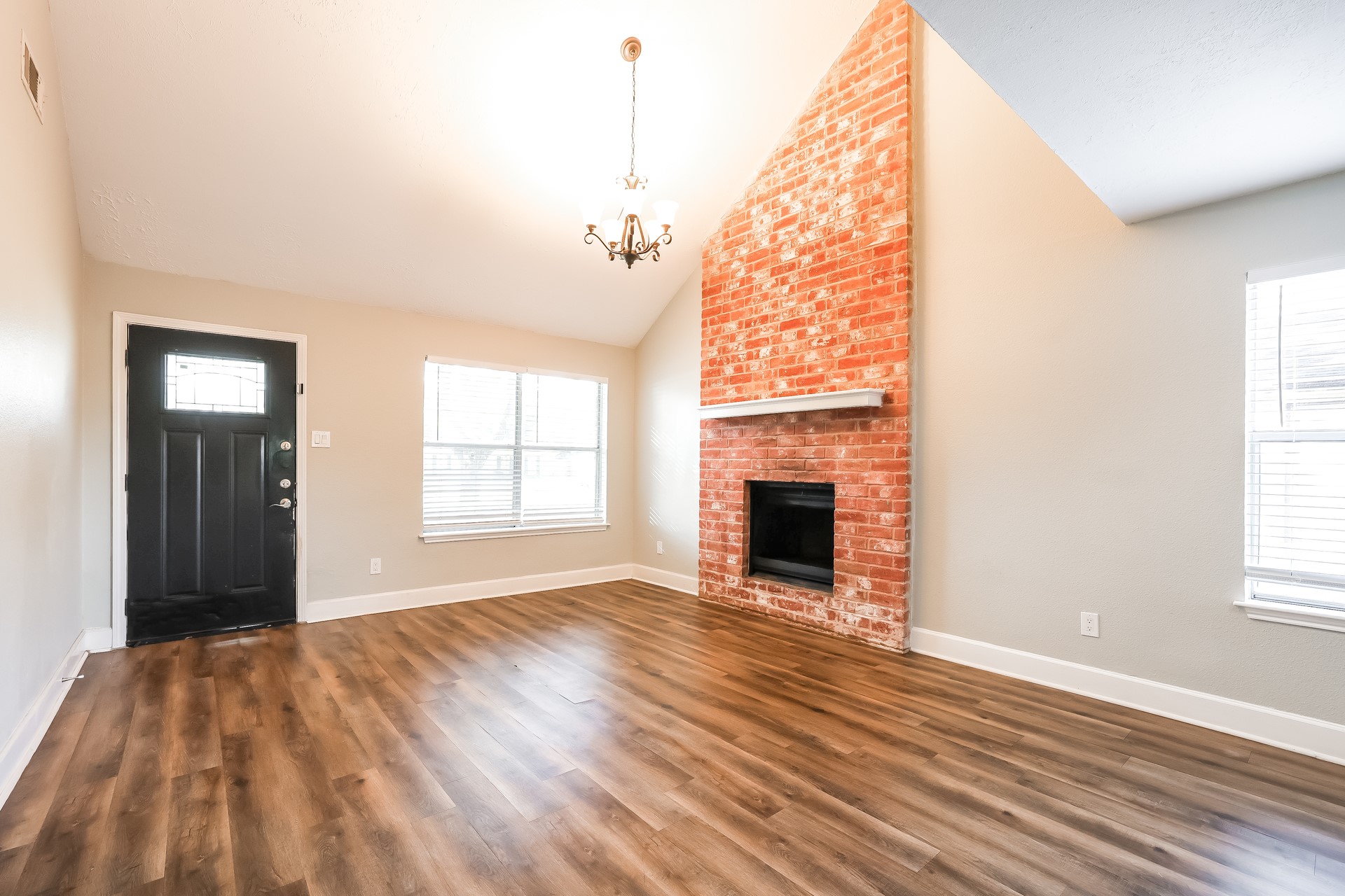 22826 Provincial Boulevard Katy, TX 77450 - Photo 5 of 18 a view of an empty room with wooden floor and a window