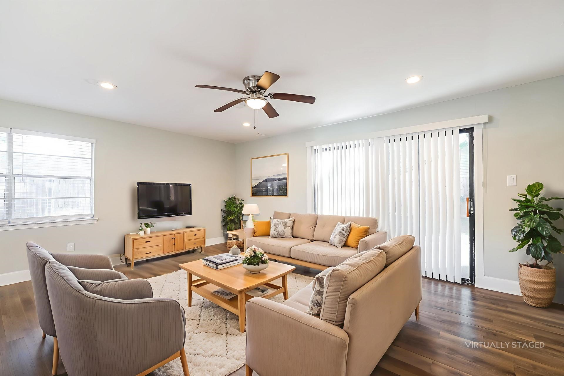 22826 Provincial Boulevard Katy, TX 77450 - Photo 8 of 18 a living room with furniture and a flat screen tv