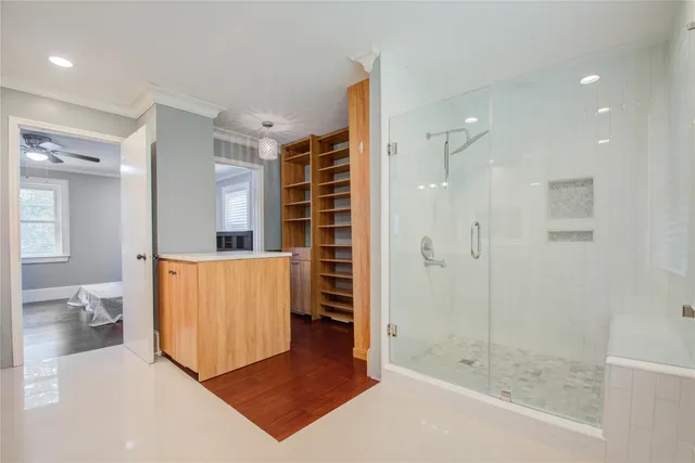 a bathroom with a bathtub and a shower