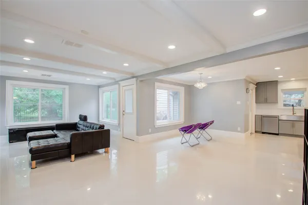 a living room with furniture or couch and a large window