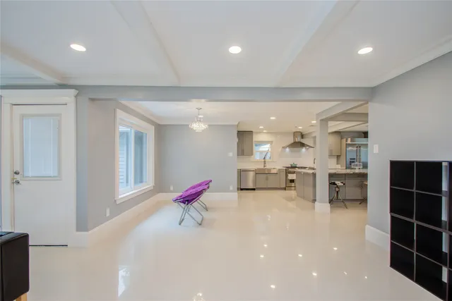 a very nice looking room with a large window and sitting area