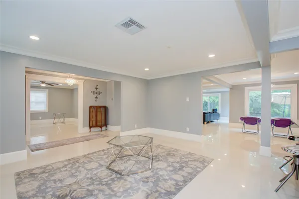 a large bedroom with a large bed and a large window