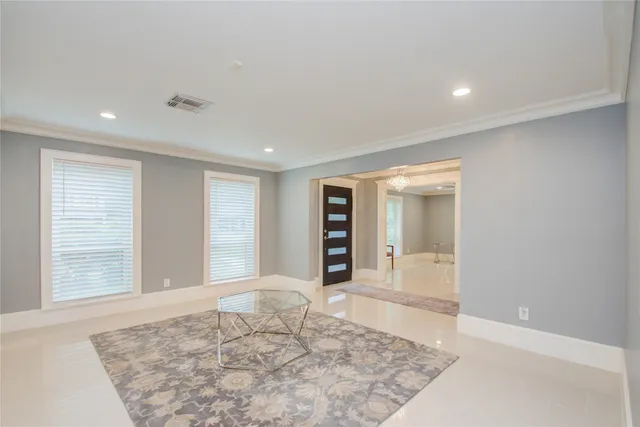 a view of a big room with windows and closet