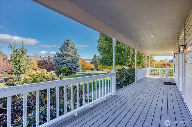 a view of a porch with wooden floor
