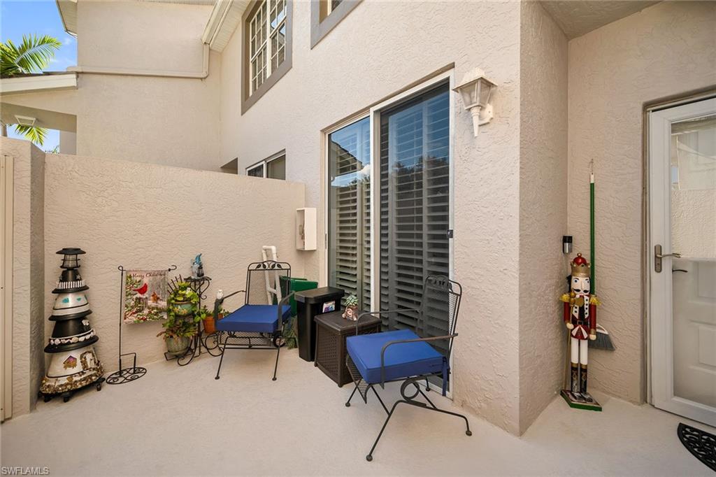 3755 Fieldstone Boulevard, Unit 1203 Naples, FL 34109 - Photo 25 of 50 a view of a room with furniture and toys