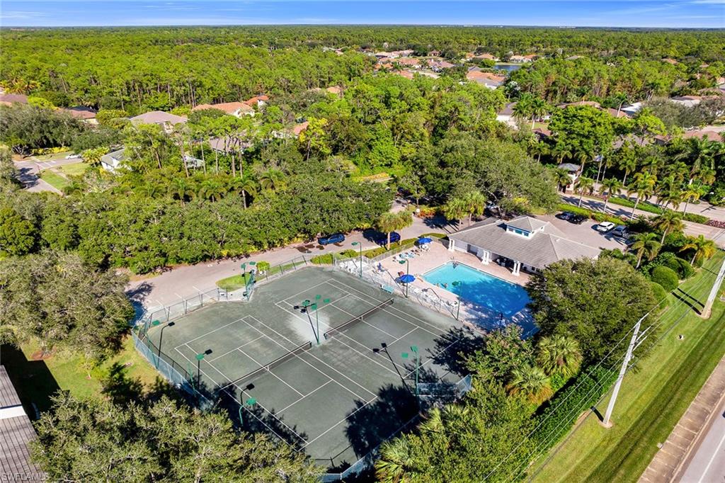 3755 Fieldstone Boulevard, Unit 1203 Naples, FL 34109 - Photo 50 of 50 an aerial view of residential houses with outdoor space