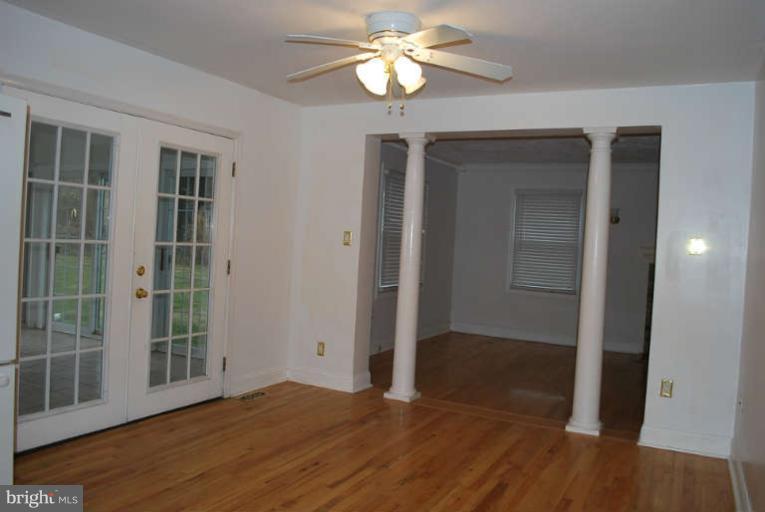 334 Old Joppa Road Fallston, MD 21047 - Photo 11 of 20 a view of empty room with wooden floor and fan