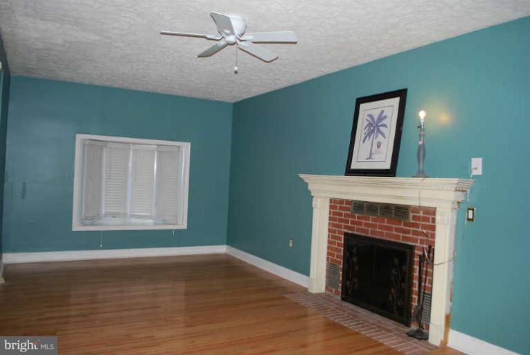334 Old Joppa Road Fallston, MD 21047 - Photo 7 of 20 a living room with a fireplace and a window