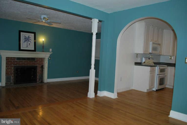 334 Old Joppa Road Fallston, MD 21047 - Photo 8 of 20 a view of a livingroom with wooden floor and a fireplace