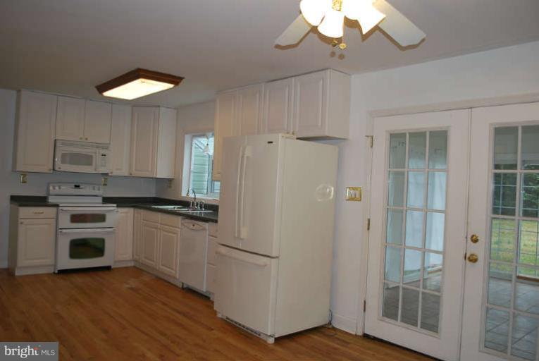 334 Old Joppa Road Fallston, MD 21047 - Photo 10 of 20 a kitchen with a refrigerator and a stove