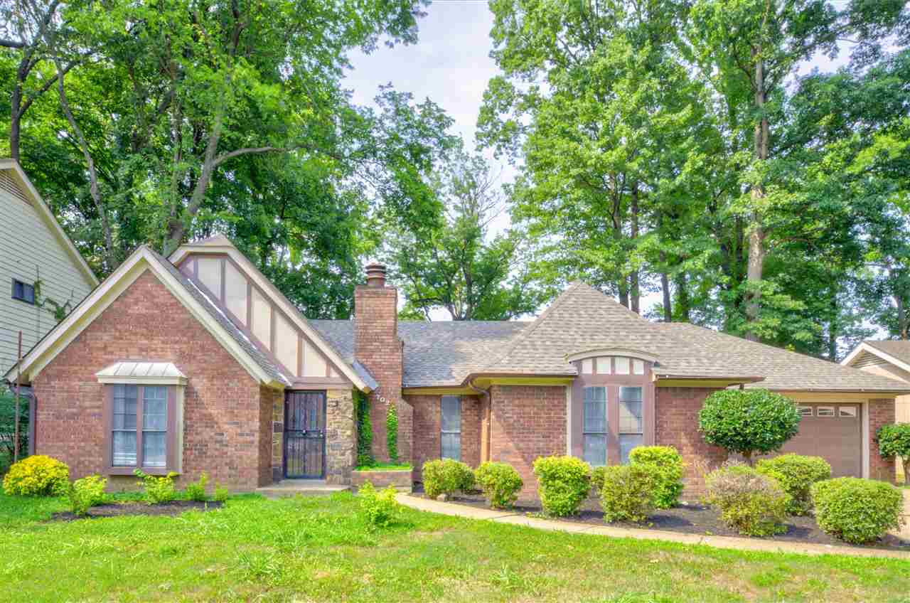 7024 Rockingham Road Memphis, TN 38125 - Photo 1 of 18 a front view of a house with a yard