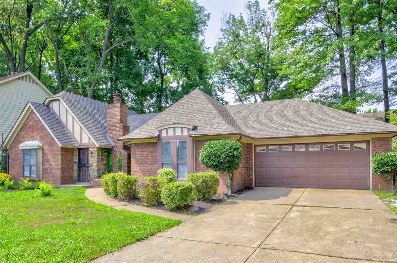 7024 Rockingham Road Memphis, TN 38125 - Photo 2 of 18 a front view of a house with garden