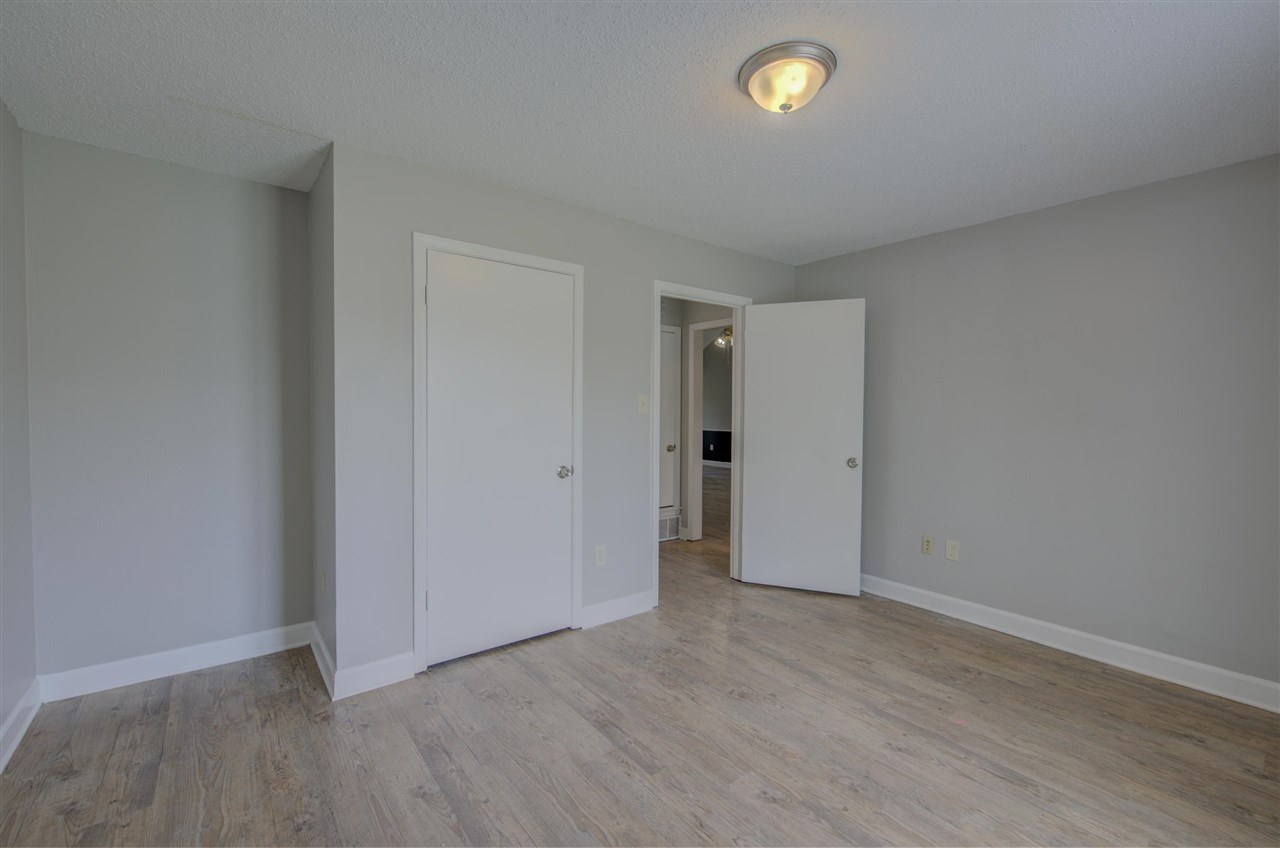 7024 Rockingham Road Memphis, TN 38125 - Photo 14 of 18 a view of an empty room with a window