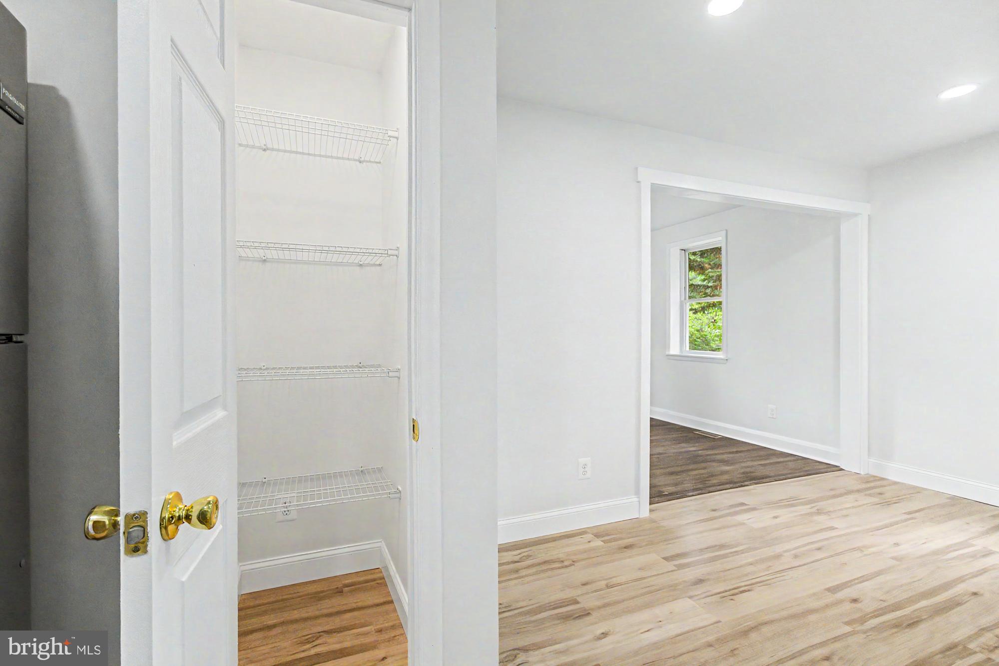 604 Prospect Mill Road Bel Air, MD 21015 - Photo 16 of 36 an empty room with wooden floor closet and windows