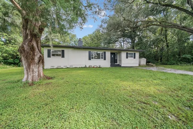 front view of a house with a yard