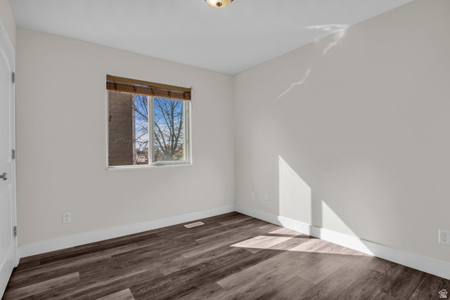1836 West 800 North Mapleton, UT 84663 - Photo 13 of 38 Spare room with dark wood-style floors and baseboards