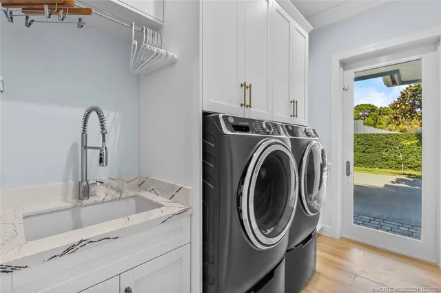 a view of a house with swimming pool and sitting area
