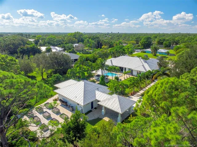 an aerial view of a house with a garden