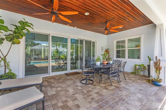 a kitchen with a sink cabinets and wooden floor