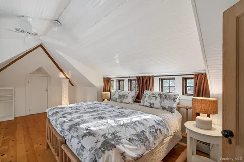 a bedroom with a bed and dresser