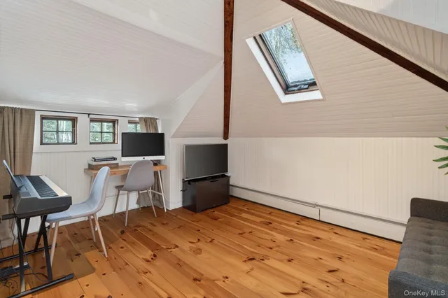 a view of kitchen with furniture and wooden floor