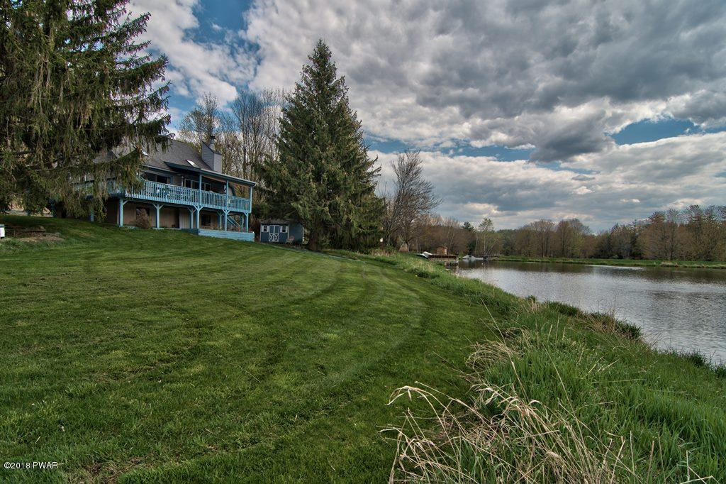 2327 Brookfield Road Lake Ariel, PA 18436 - Photo 37 of 53 a view of a lake with a house in the background