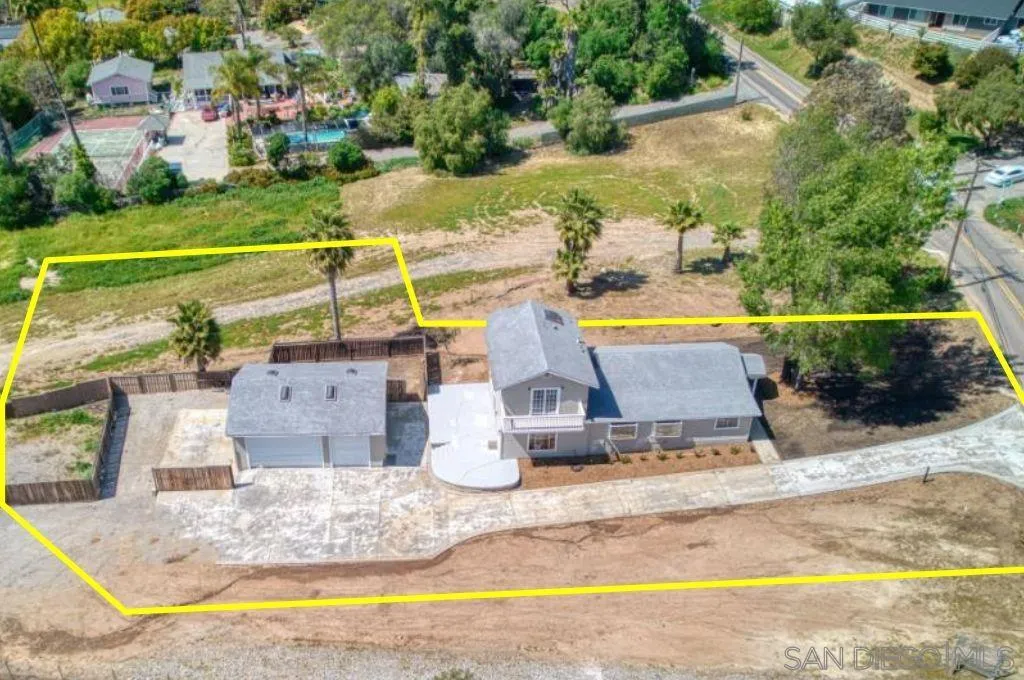 an aerial view of a house with a swimming pool