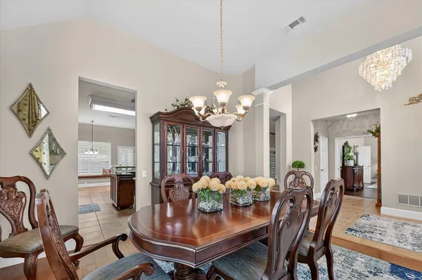 a view of livingroom with furniture a flat screen tv and wooden floor