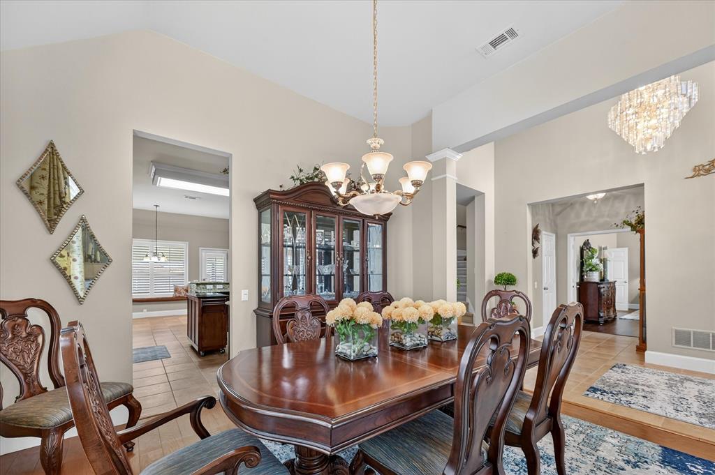1371 San Rafael Drive Rockwall, TX 75087 - Photo 12 of 35 a view of a dining room with furniture and a chandelier