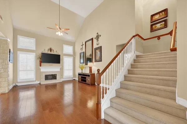 a view of an entryway and livingroom with wooden floor