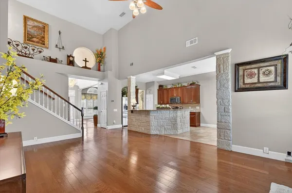 a kitchen with stainless steel appliances granite countertop wooden cabinets a stove top oven a sink and dishwasher