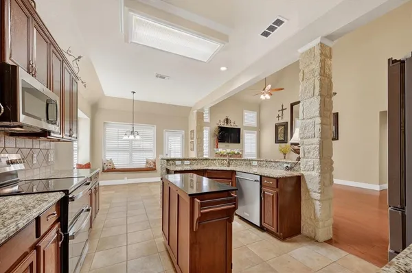 a view of a livingroom with furniture and stairs