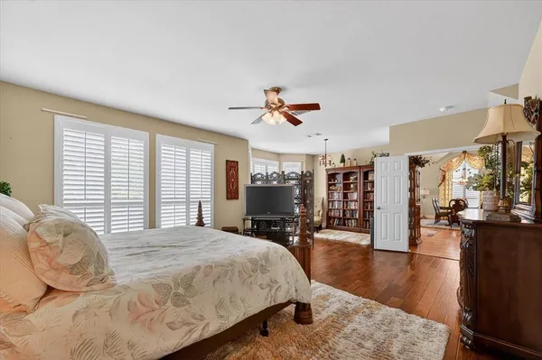 a living room with fireplace furniture and a book shelf