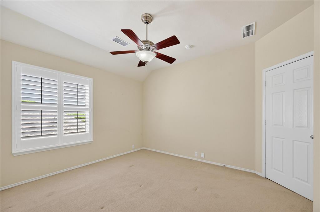 1371 San Rafael Drive Rockwall, TX 75087 - Photo 27 of 35 an empty room with a window and a fan