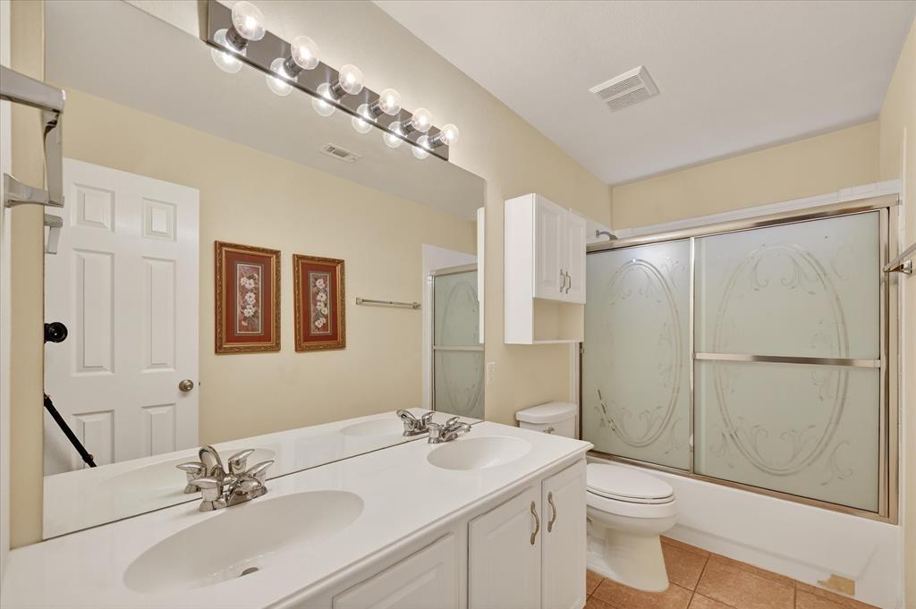 1371 San Rafael Drive Rockwall, TX 75087 - Photo 29 of 35 a bathroom with a sink toilet and shower