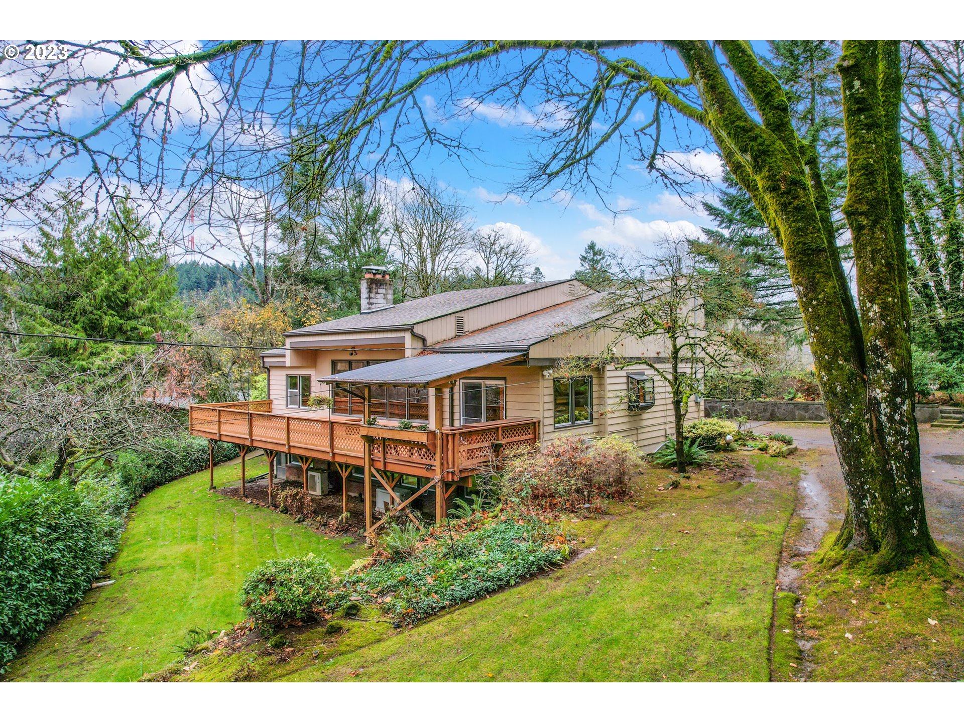 a aerial view of a house with yard and sitting area