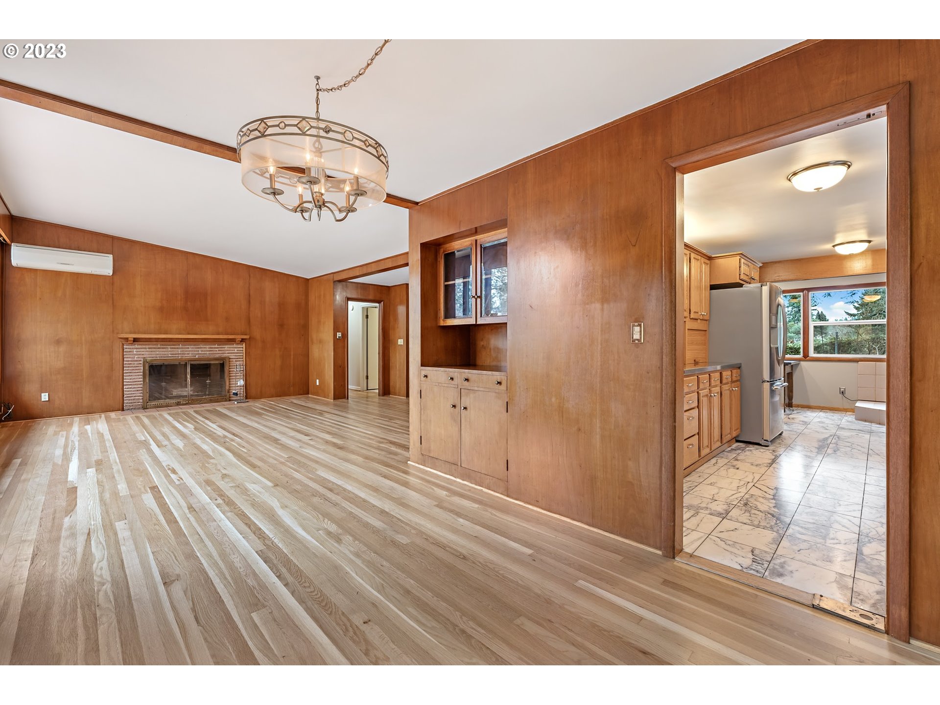2435 Southwest Dakota Street Portland, OR 97239 - Photo 12 of 47 a view of livingroom with kitchen and dining area