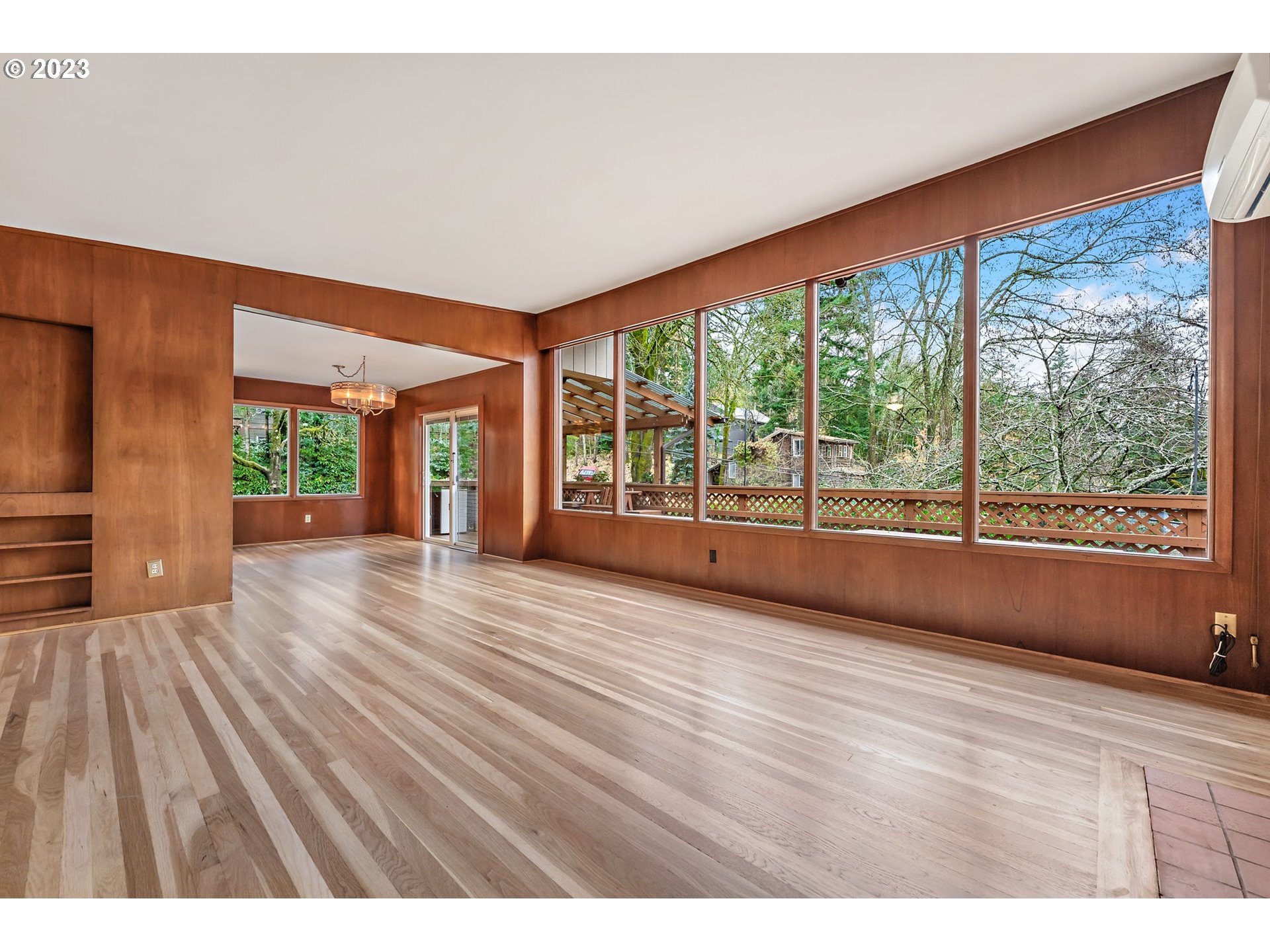 2435 Southwest Dakota Street Portland, OR 97239 - Photo 16 of 47 a view of an empty room with wooden floor and a window