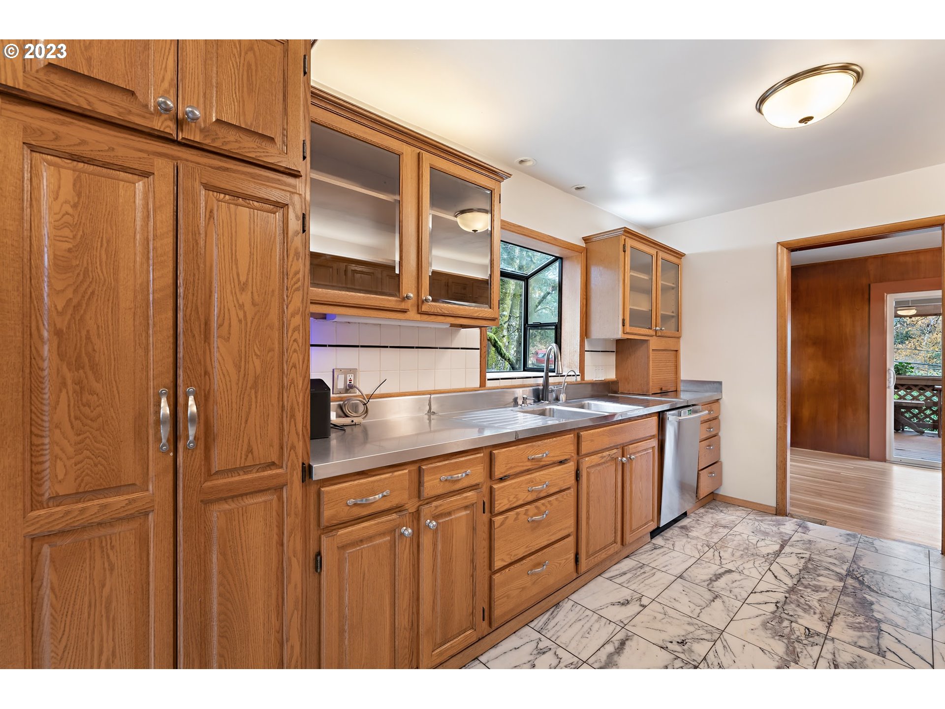 2435 Southwest Dakota Street Portland, OR 97239 - Photo 17 of 47 a bathroom with a double vanity sink and a mirror