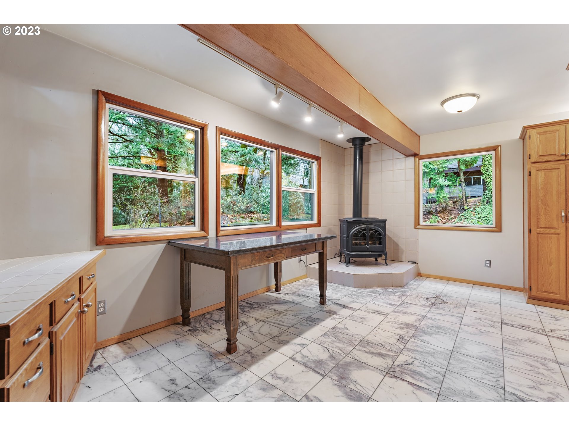 2435 Southwest Dakota Street Portland, OR 97239 - Photo 22 of 47 a living room with furniture a window and a dining table