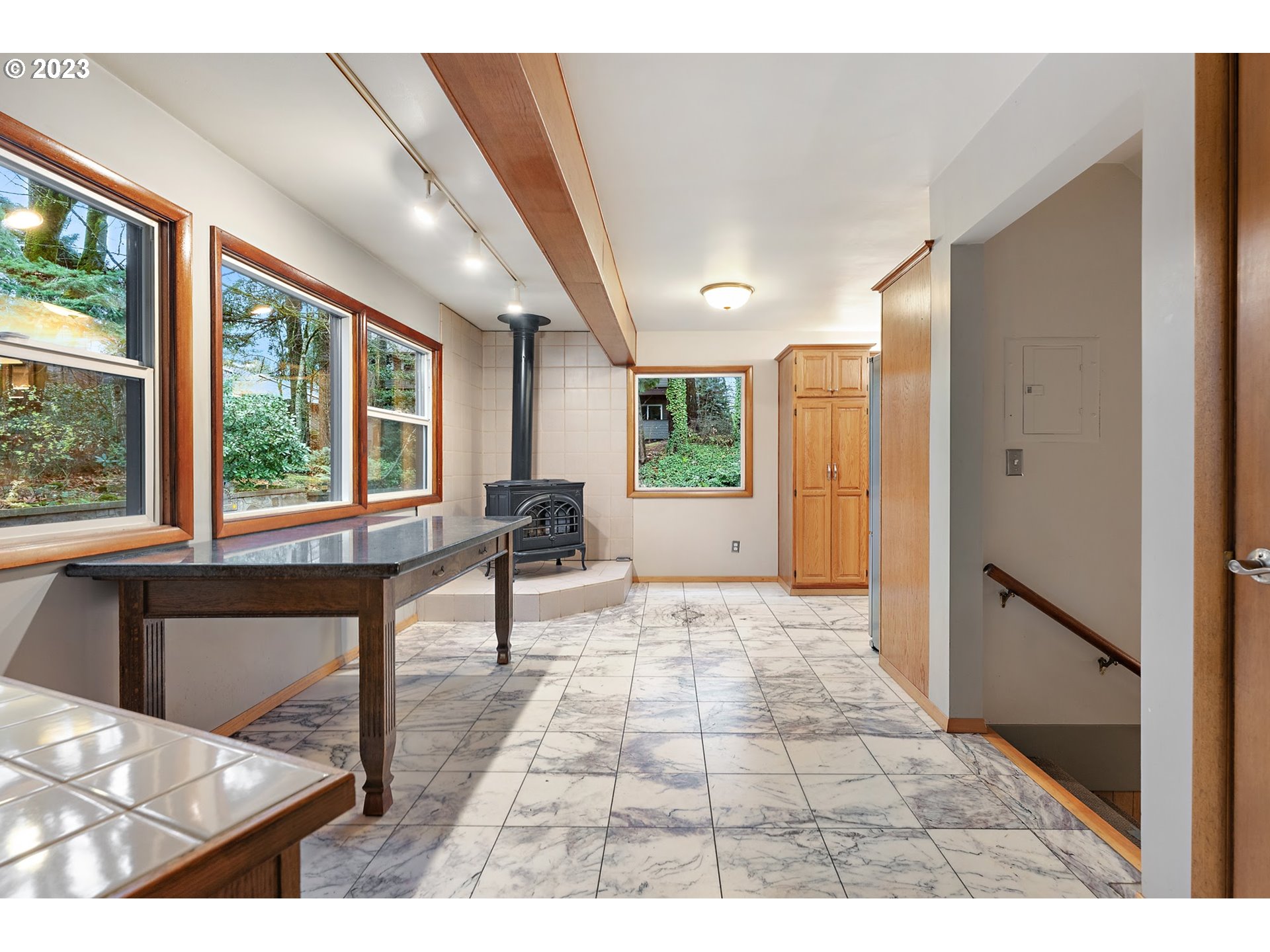 2435 Southwest Dakota Street Portland, OR 97239 - Photo 23 of 47 a view of a hallway with furniture and windows