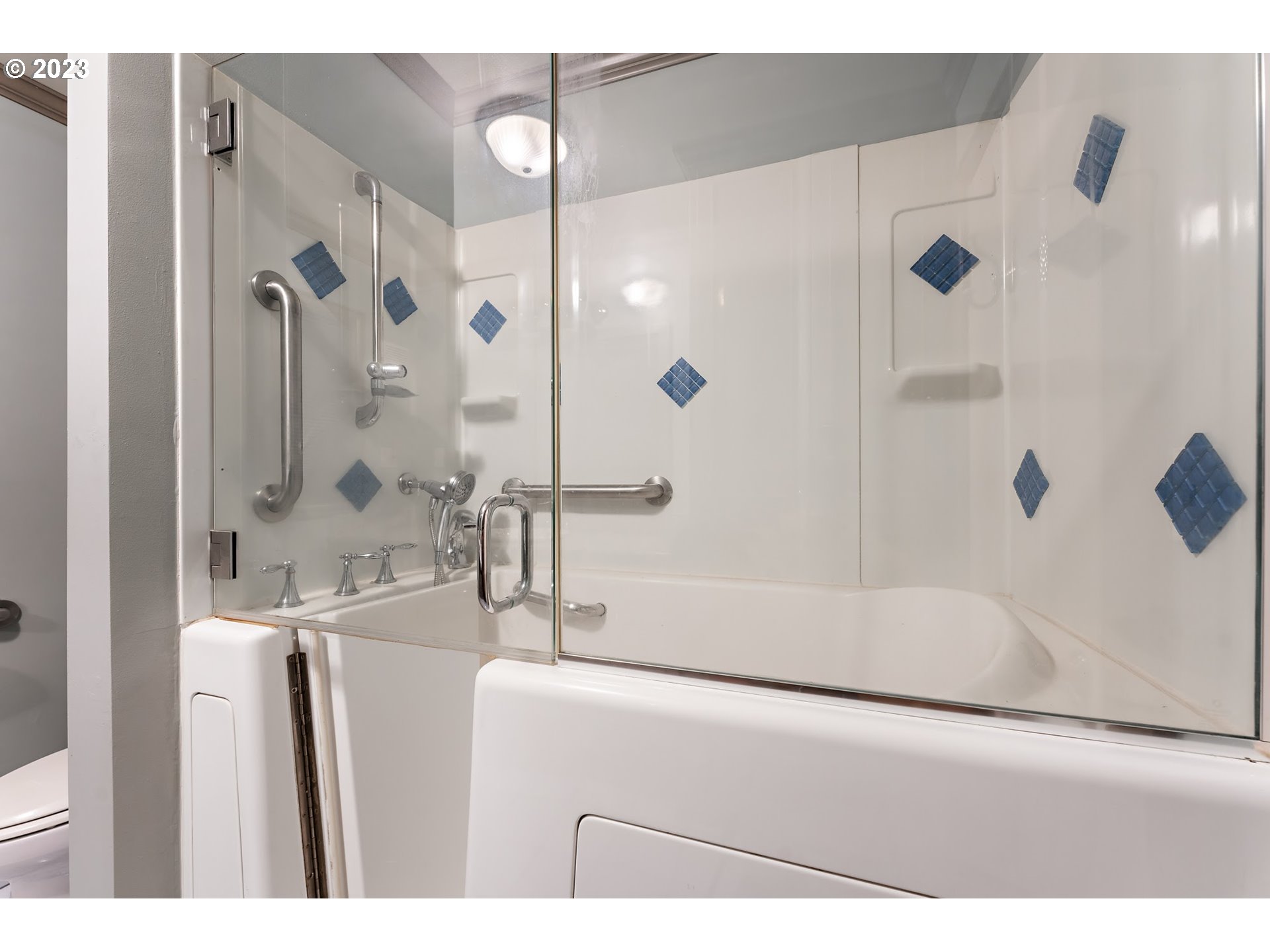 2435 Southwest Dakota Street Portland, OR 97239 - Photo 31 of 47 a bathroom with a bathtub and a shower