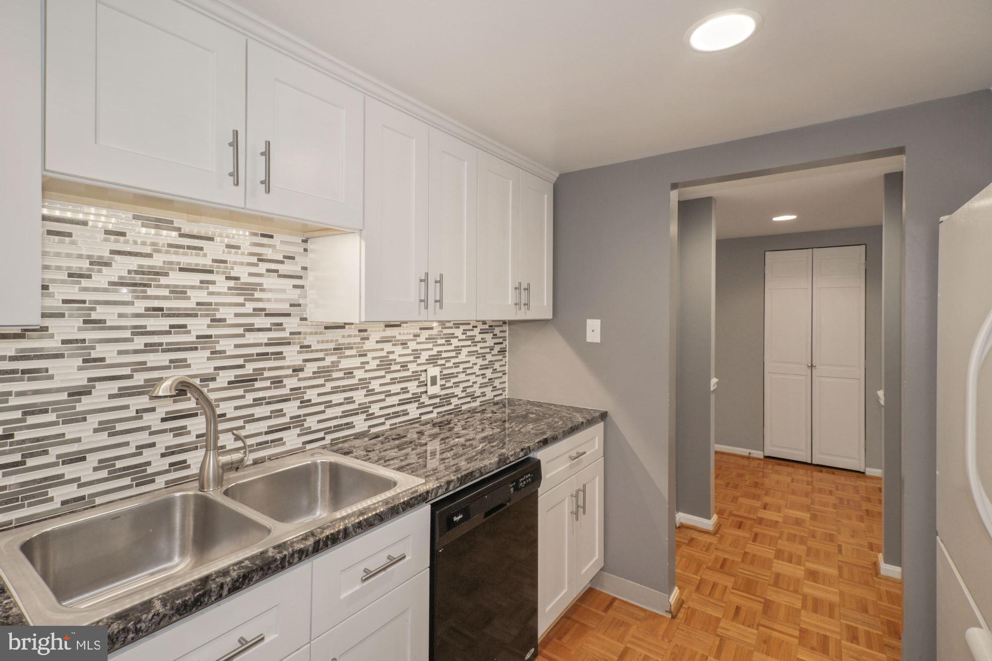 1040 Deer Ridge Drive, Unit 309 Baltimore, MD 21210 - Photo 2 of 31 Shaker cabinets, glass tile back splash
